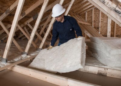 Austin Company | installation of white fiberglass in residential attic